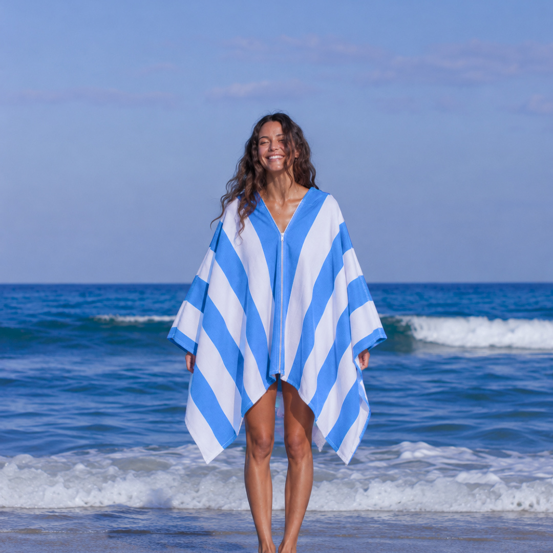 Front view of the blue and white Zippa hands-free micro-fibre towel zipped closed around the shoulders 