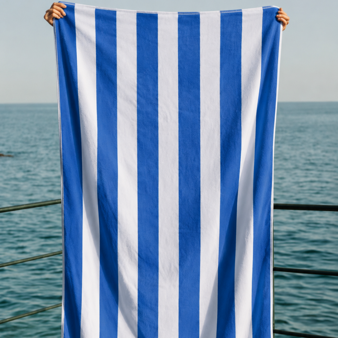 The Zippa Towel held open flat, showing the full-size blue and white striped beach hands-free micro-fibre towel